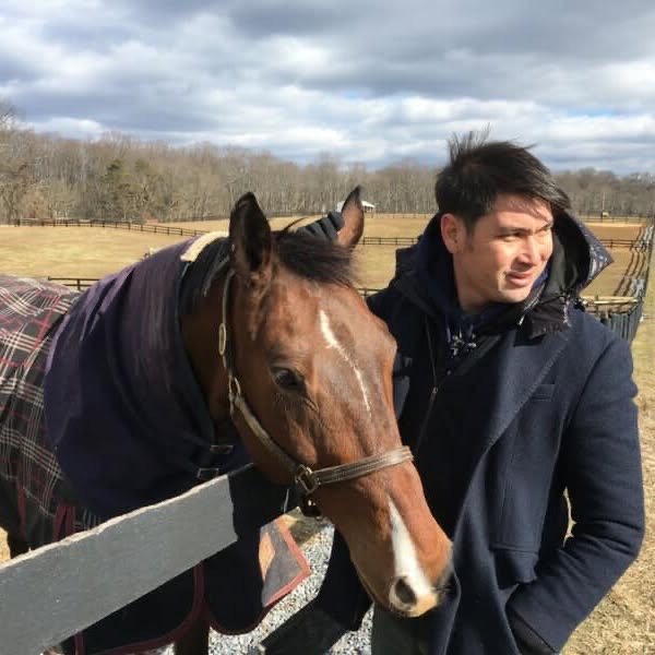 Brian Wee with one of his horses.