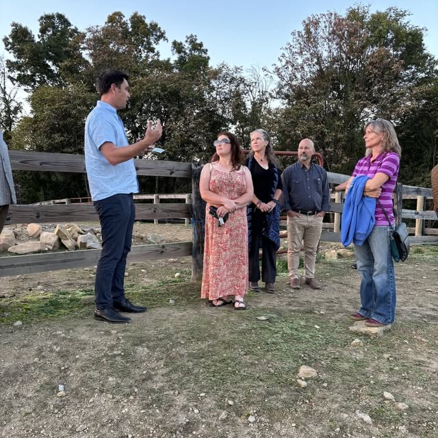 Brian coaching owners on location at a barn.
